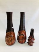 A PAIR OF LARGE DESIGNER CARVED WOODEN VASES - HEIGHT 76CM AND ONE SMALLER OF MATCHING DESIGN.