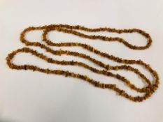 A STRAND OF RAW AMBER STONE L 184CM.