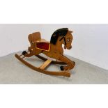 A VINTAGE WOODEN ROCKING HORSE.