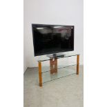 PANASONIC 42" FLAT SCREEN TV MODEL TX-L42ET5B COMPLETE WITH MODERN 3 TIER GLASS STAND.