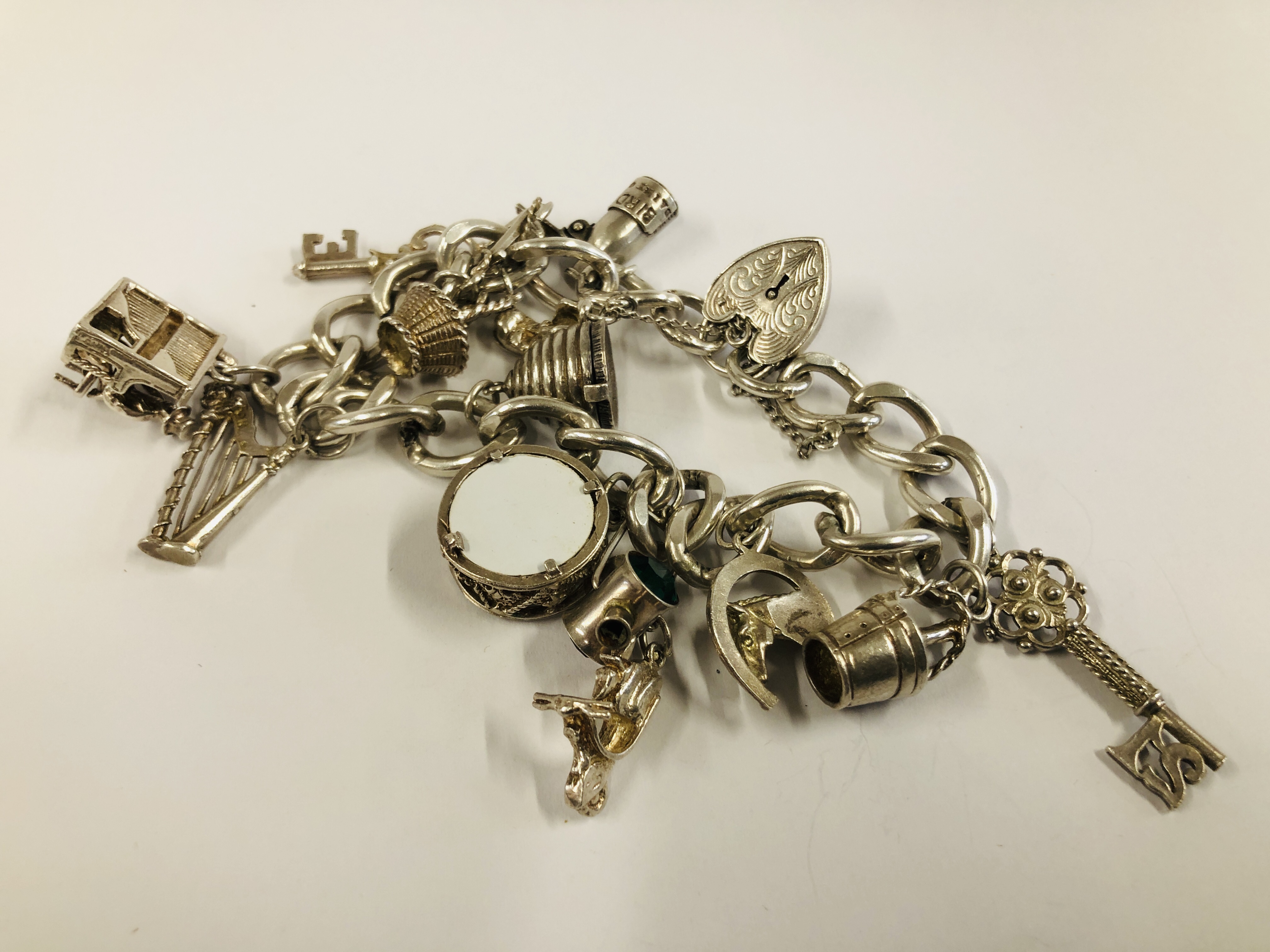 SILVER CHARM BRACELET WITH 13 CHARMS ATTACHED. - Image 6 of 6