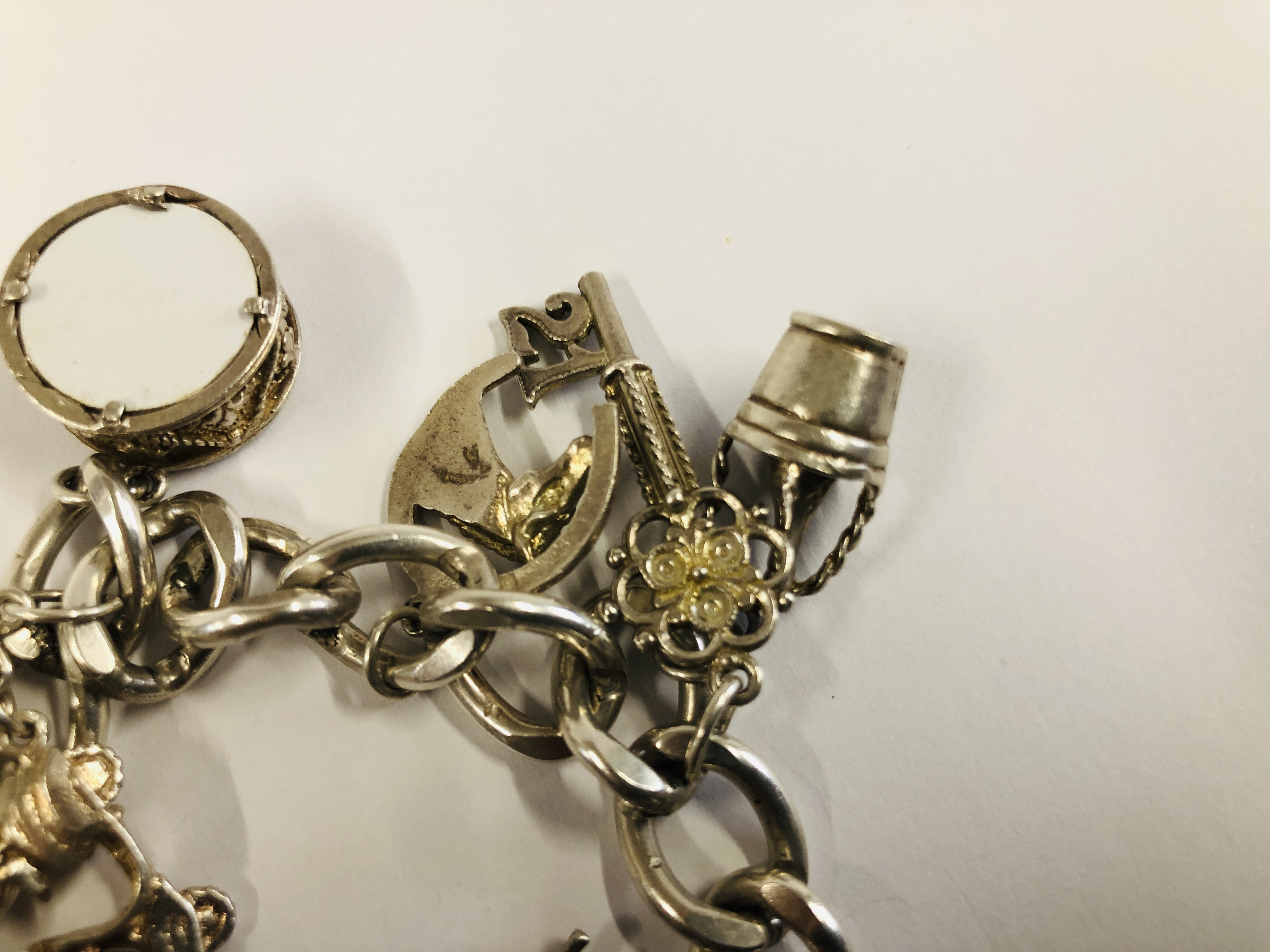 SILVER CHARM BRACELET WITH 13 CHARMS ATTACHED. - Image 5 of 6