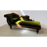 A VICTORIAN MAHOGANY FRAMED CHAISE LONGUE FINISHED IN GREEN VELOUR.