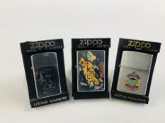 A GROUP OF THREE VARIOUS ZIPPO LIGHTERS TO INCLUDE LANZAROTE,
