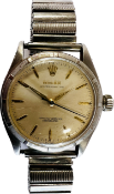 A 1960's ROLEX OYSTER PERPTUAL AUTOMATIC WRIST WATCH ON EXPANDABLE STRAP STAMPED 6085 MODEL F D E