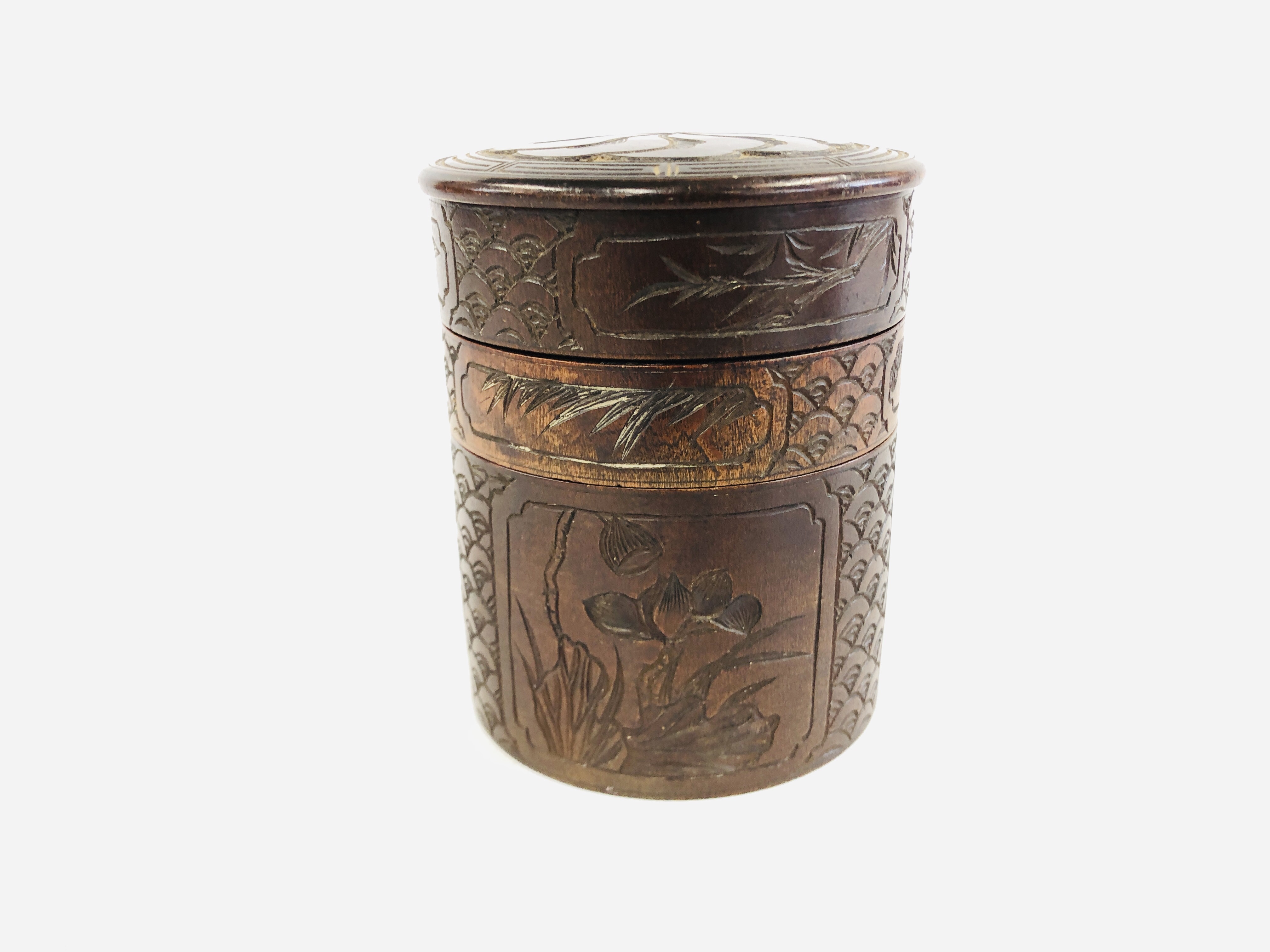 A HAND CARVED CYLINDRICAL DIVISIONAL CONTAINER DECORATED WITH BIRDS AND FOLIAGE - HEIGHT 14CM,