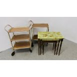2 VINTAGE 60'S TWO TIER TEA TROLLEYS AND A NEST OF 3 RETRO GRADUATED TABLES WITH ONYX STYLE TOPS.