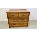 A SOLID OAK TWO OVER TWO CHEST OF DRAWERS LENGTH 91CM. DEPTH 50CM. HEIGHT 74CM.