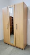 A MODERN BEECH WOOD FINISH TRIPLE WARDROBE WITH CENTRAL MIRRORED DOOR - W 115CM. D 52CM. H 185CM.