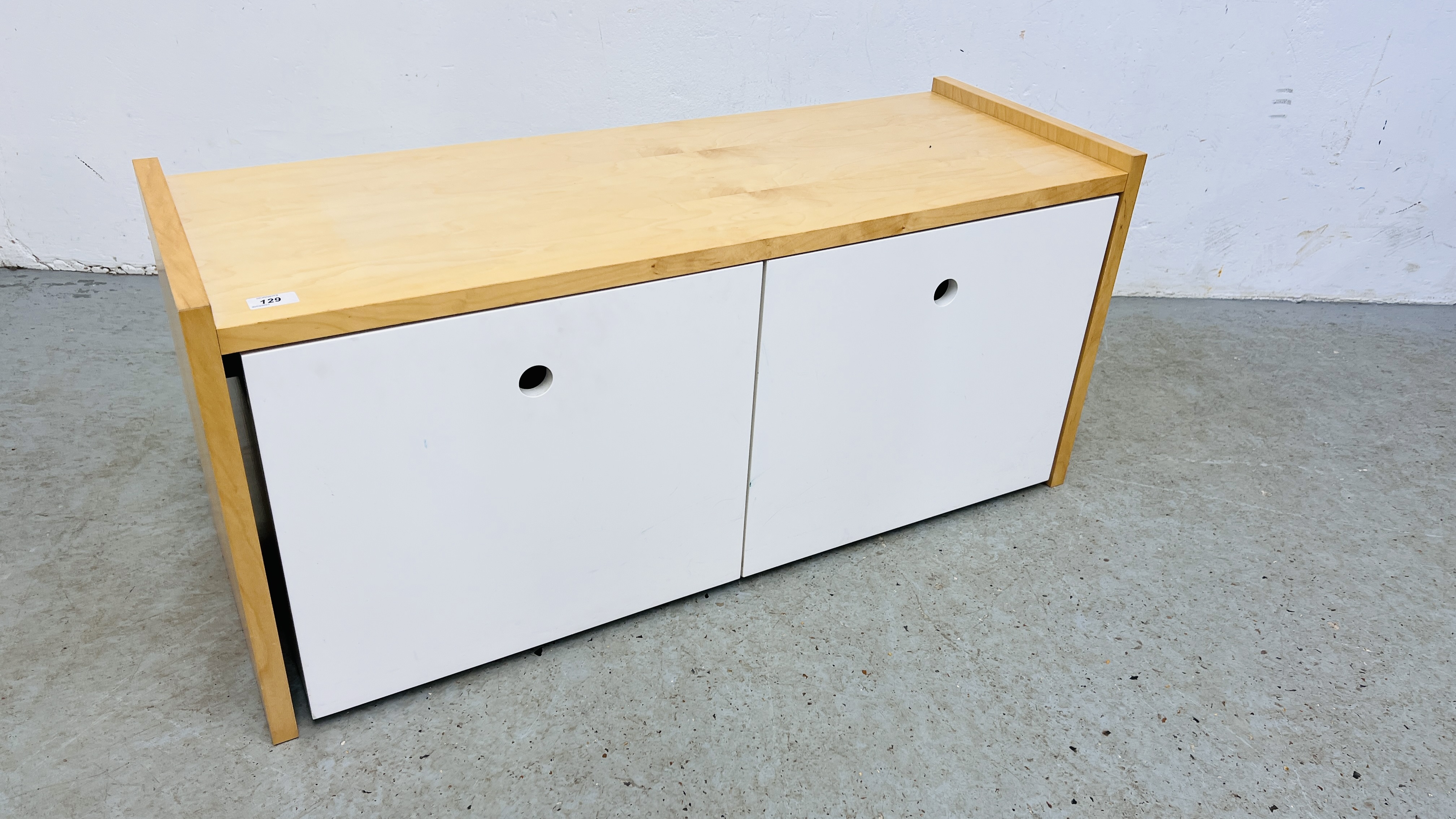 MODERN BEECHWOOD FINISH STORAGE UNIT WITH TWO ROLL OUT DRAWERS.