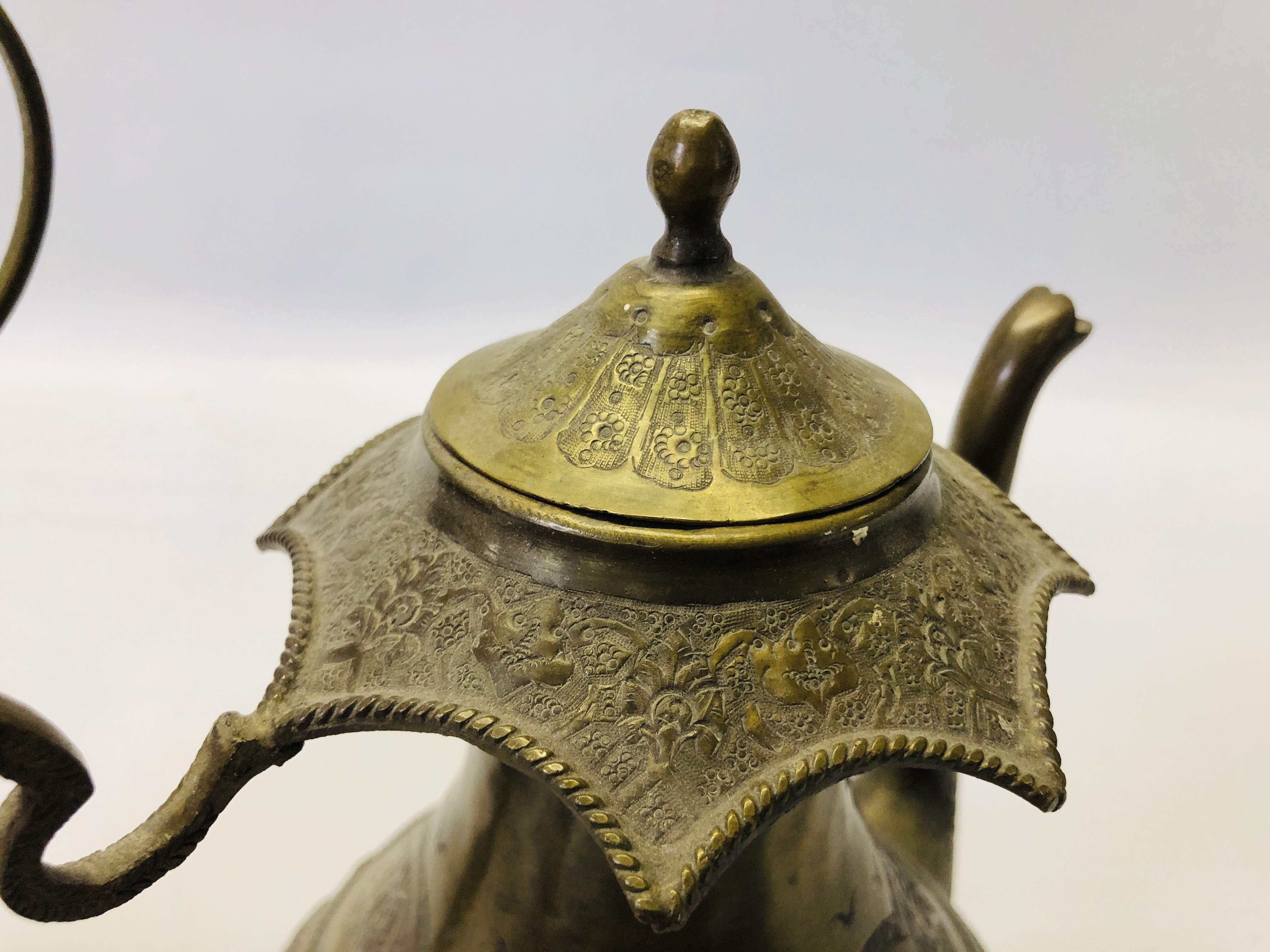 A VINTAGE MIDDLE EASTERN BRASS EWER ALONG WITH AN ELABORATE MIDDLE EASTERN BRASS COFFEE POT. - Image 6 of 21