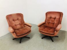 PAIR OF RETRO PINK VELOUR UPHOLSTERED REVOLVING RELAXER CHAIRS (COLLECTORS ITEM ONLY)