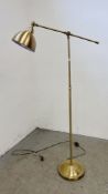 A MODERN BRASS FINISH ADJUSTABLE STANDARD LAMP - SOLD AS SEEN.