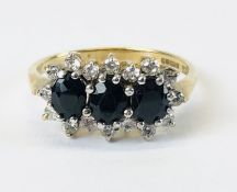 A 9CT GOLD WHITE AND BLUE STONE SET DRESS RING.
