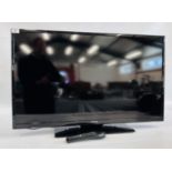 A CELCUS 40" FLAT SCREEN TV WITH REMOTE - SOLD AS SEEN.