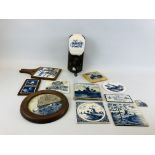 A GROUP OF DELFT TILES, STANDS AND PLAQUES ALONG WITH A WALL MOUNTED CHURN ETC.