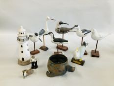 A GROUP OF 7 WOODEN SEA BIRD FIGURES HIGHEST 31CM ALONG WITH POTTERY LIGHT HOUSE,