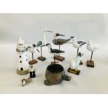 A GROUP OF 7 WOODEN SEA BIRD FIGURES HIGHEST 31CM ALONG WITH POTTERY LIGHT HOUSE,