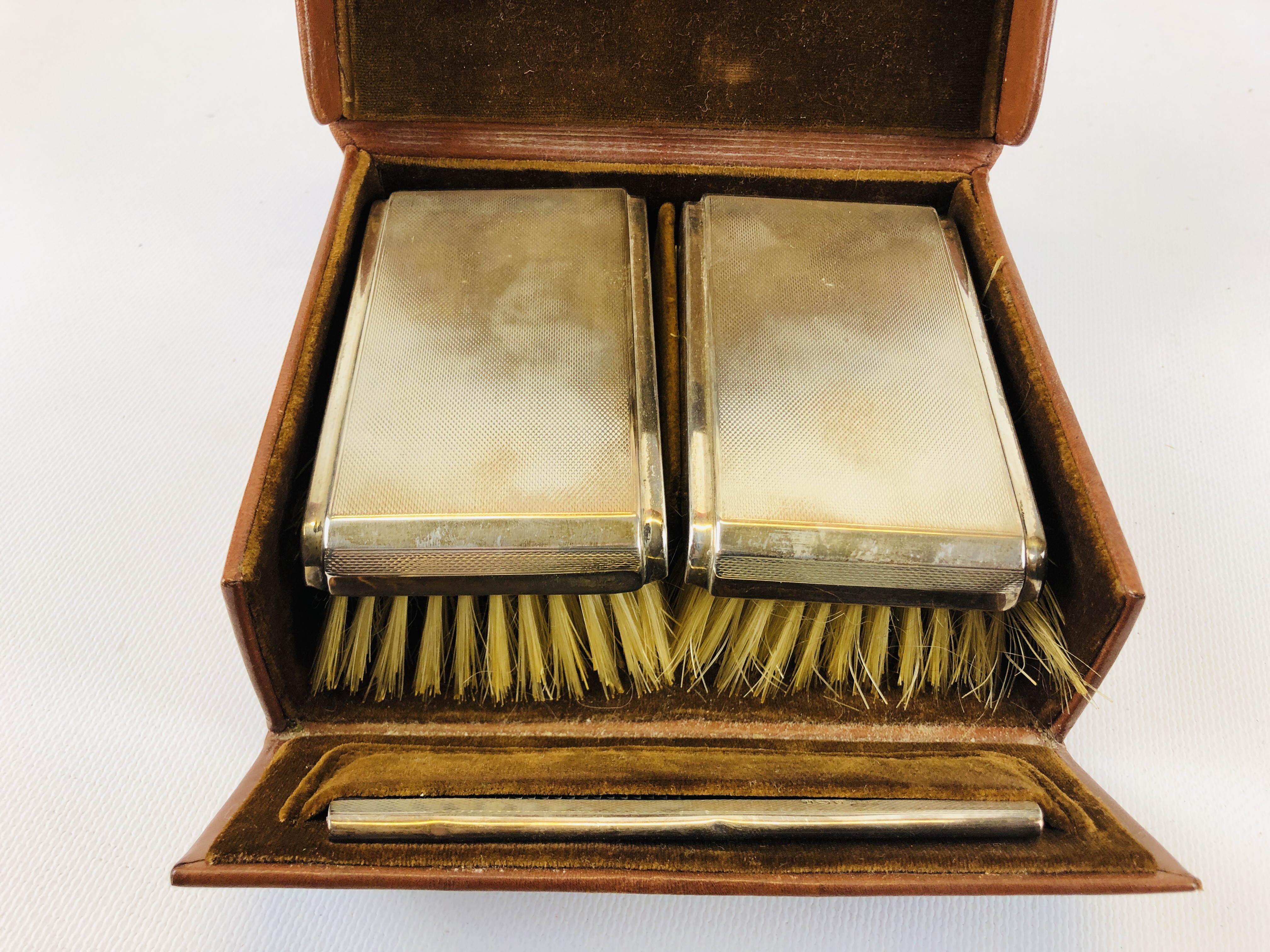 SILVER BACKED BRUSH AND COMB SET IN TAN LEATHER TRAVELLING CASE. - Image 2 of 5