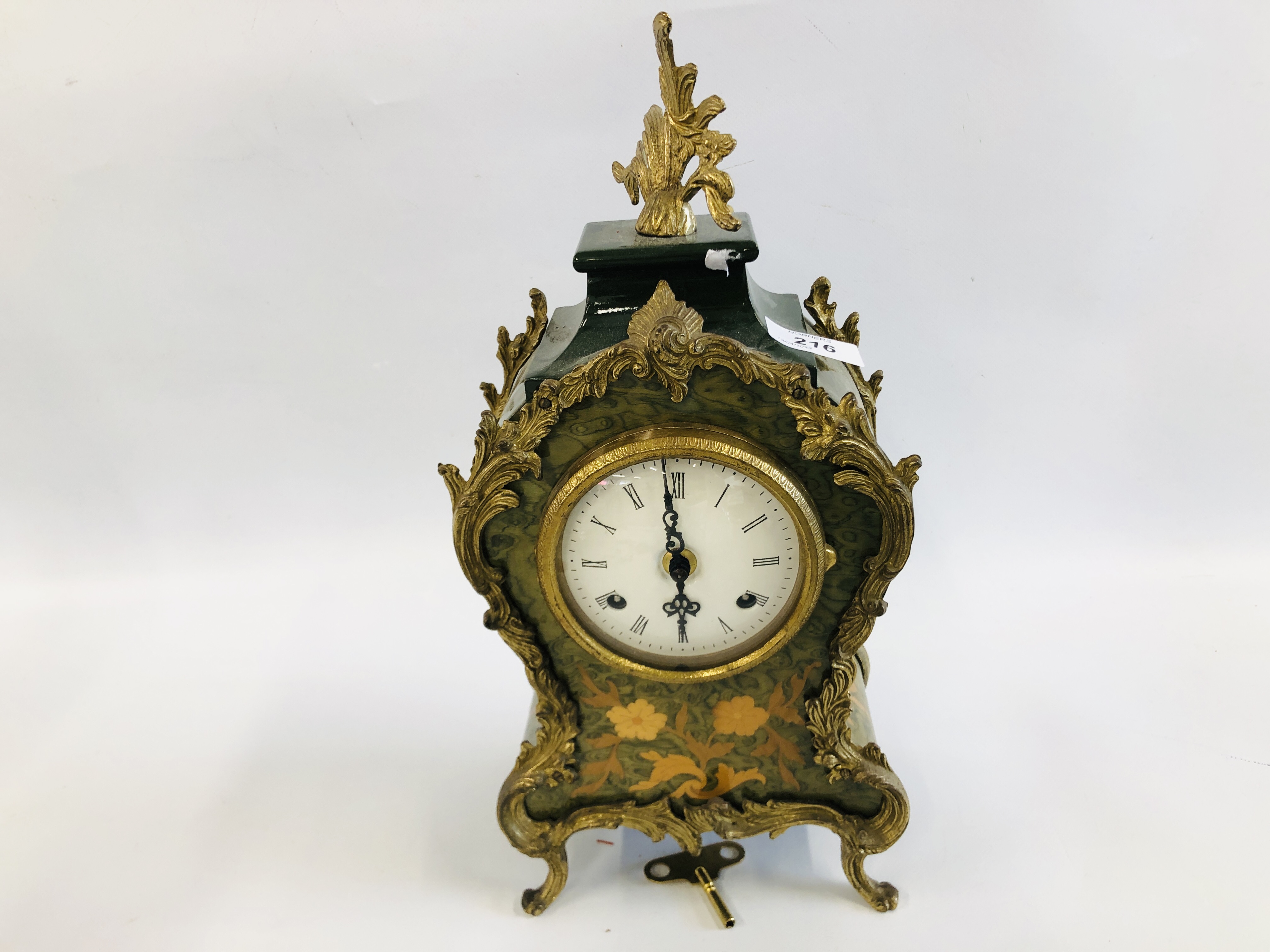 AN ORNATE BRASS DETAILED INLAID MANTEL CLOCK. 37CM.