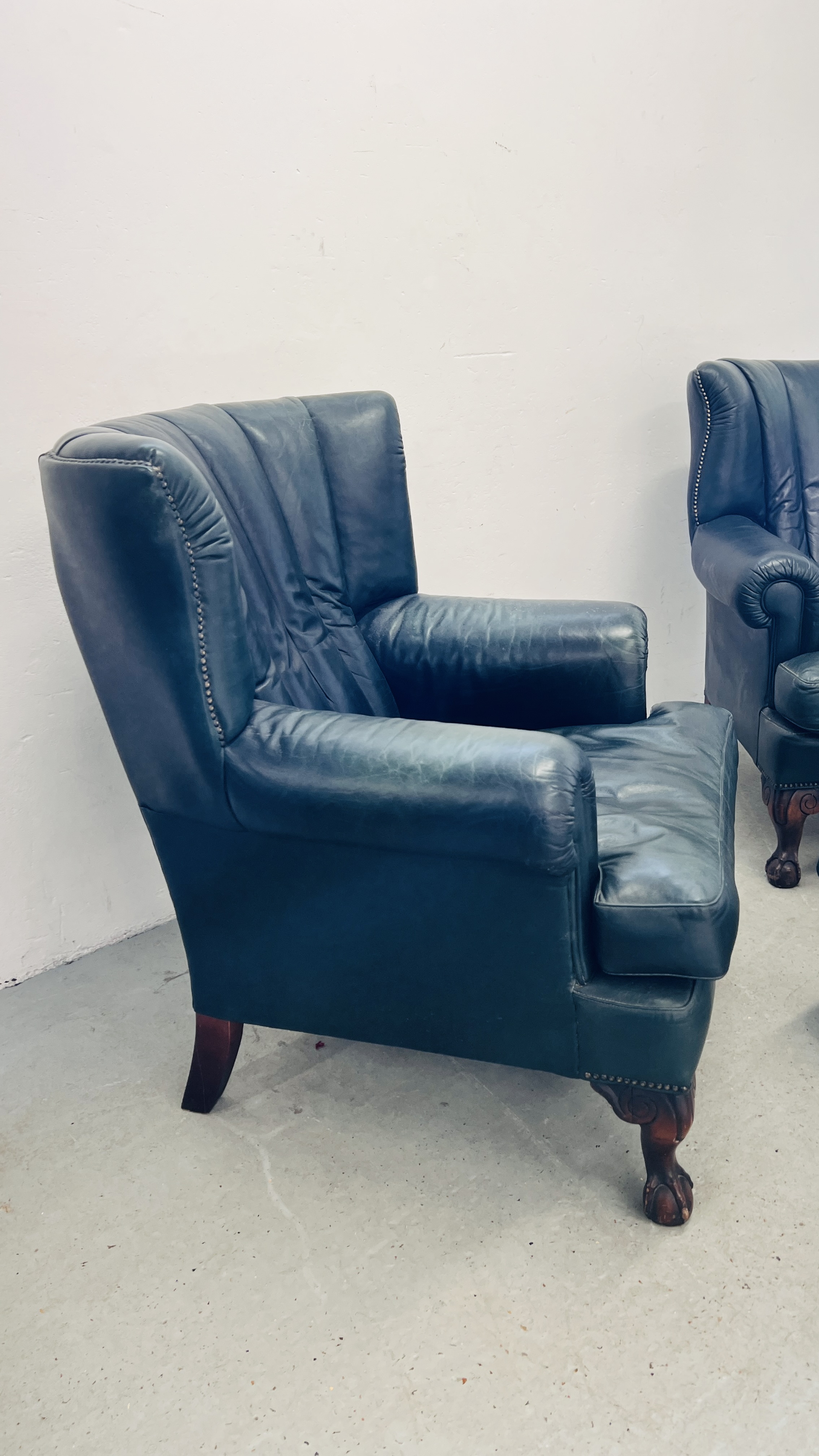 A PAIR OF MODERN BOTTLE GREEN LEATHER WING BACK FIRE SIDE ARMCHAIRS ON BALL AND CLAW FEET ALONG - Image 4 of 13