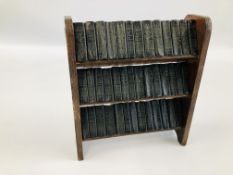 A VINTAGE SET OF 40 MINIATURE BOOKS BY WILLIAM SHAKESPEARE DISPLAYED IN A MINIATURE WOODEN STAND.