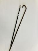 AN ANTIQUE TOPPED SILVER SWAGGER STICK AND SILVER TOPPED WALKING CANE.