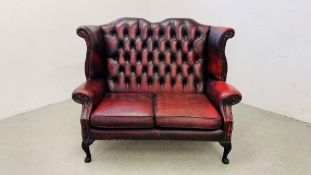 OXBLOOD LEATHER TWO SEATER WINGBACK SOFA, W 130CM X H 102CM.
