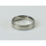 A PLATINUM WEDDING BAND SIZE V/W.