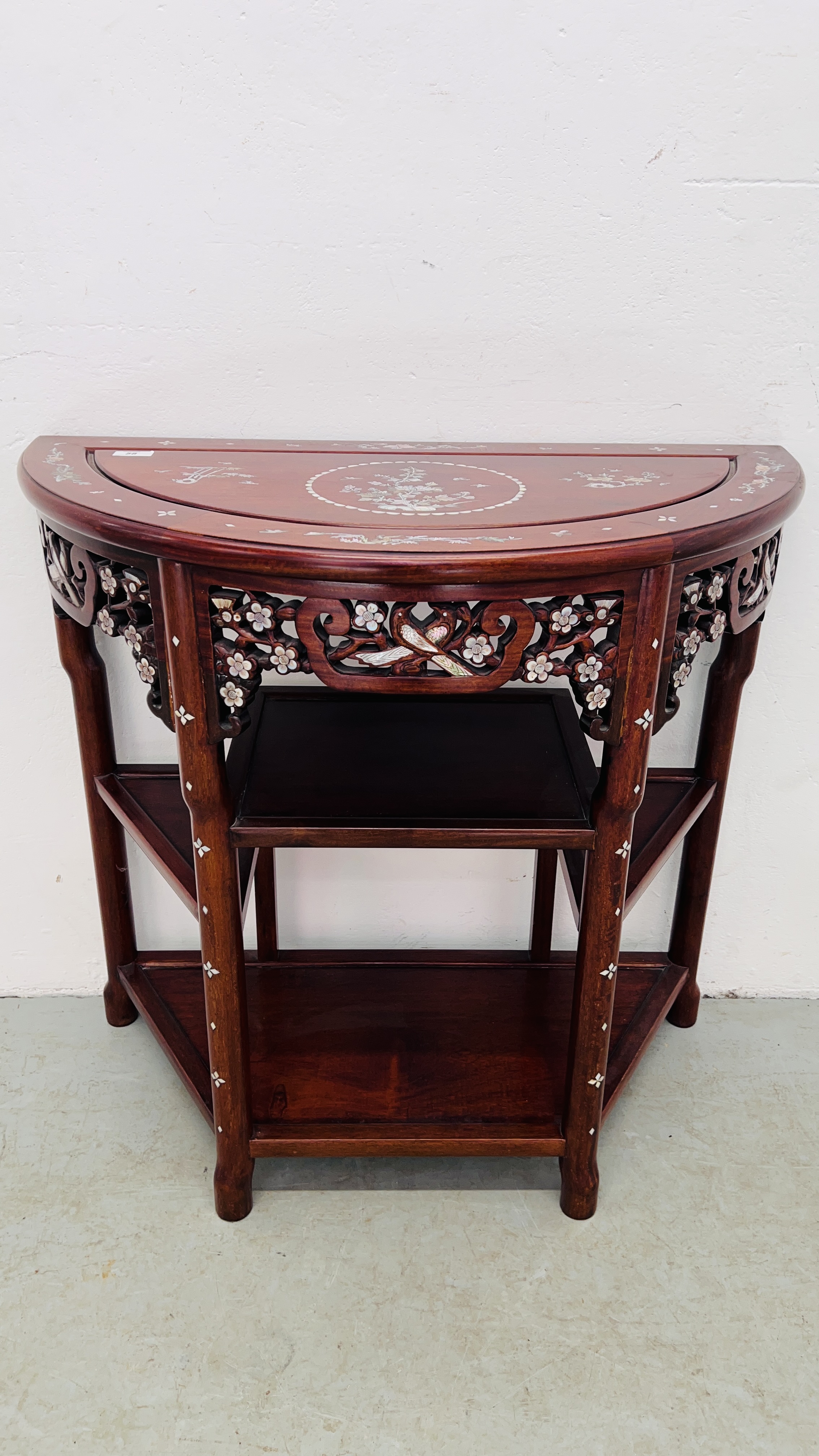 AN ORIENTAL HARDWOOD AND MOTHER OF PEARL INLAID SIDE TABLE WITH SHELF BELOW.