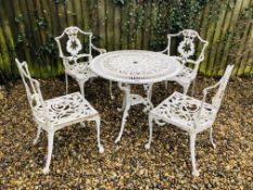 A CAST ALUMINIUM WHITE PAINTED GARDEN TABLE D 80CM ALONG WITH FOUR CHAIRS ON BALL AND CLAW FEET.