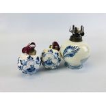 TWO HAND PAINTED DELFT BAUBLES ALONG WITH AN OIL LAMP (NO FONT).