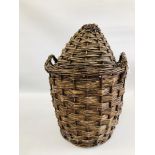 A VINTAGE GLASS DEMIJOHN IN ORIGINAL FITTED TWO HANDLED WICKER BASKET AND COVER - H 60CM.