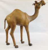 A LARGE LEATHER BOUND CAMEL - H 108CM L 95CM.