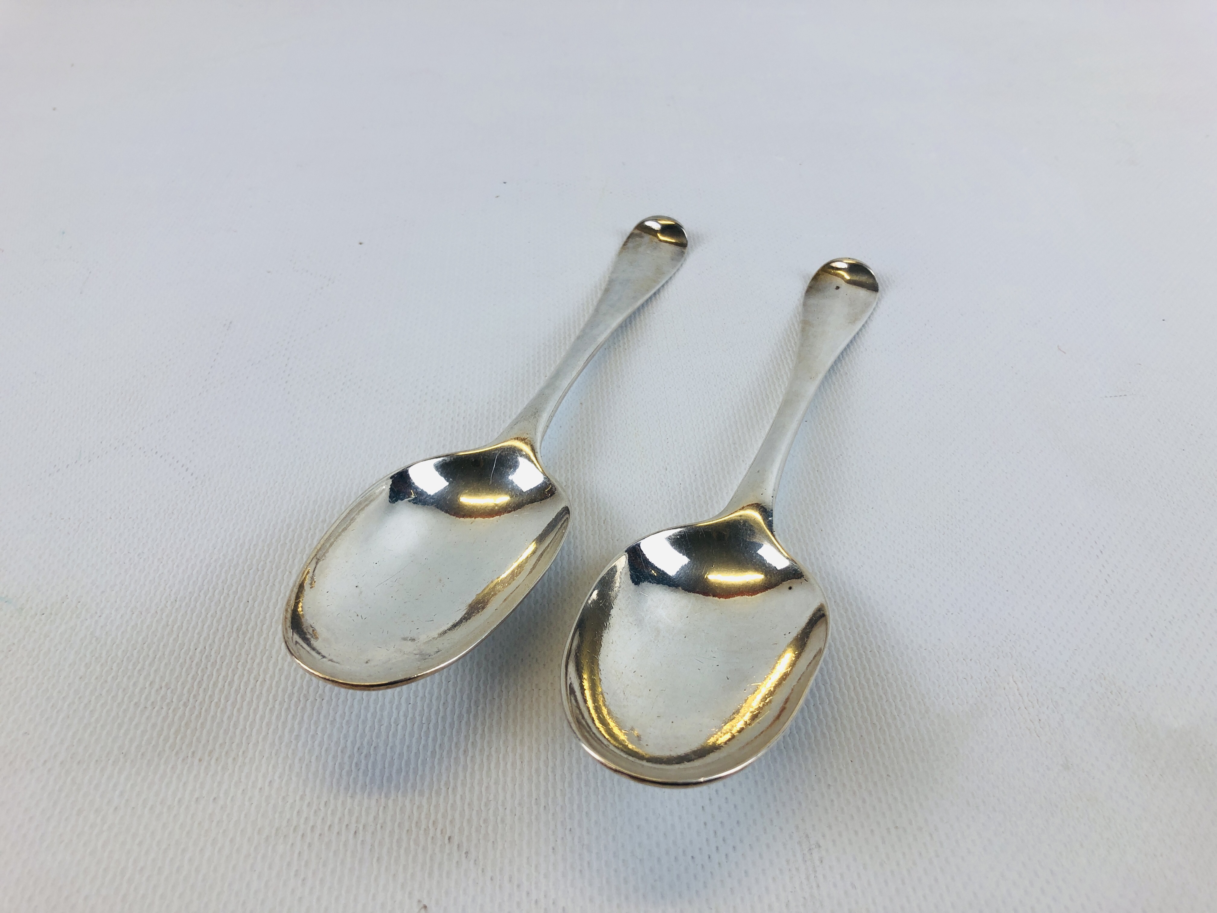 A PAIR OF GEORGE I SILVER SERVING SPOONS, LONDON 1721.