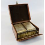 SILVER BACKED BRUSH AND COMB SET IN TAN LEATHER TRAVELLING CASE.