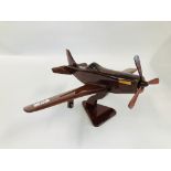 A HAND CRAFTED WOODEN SPITFIRE MODEL.