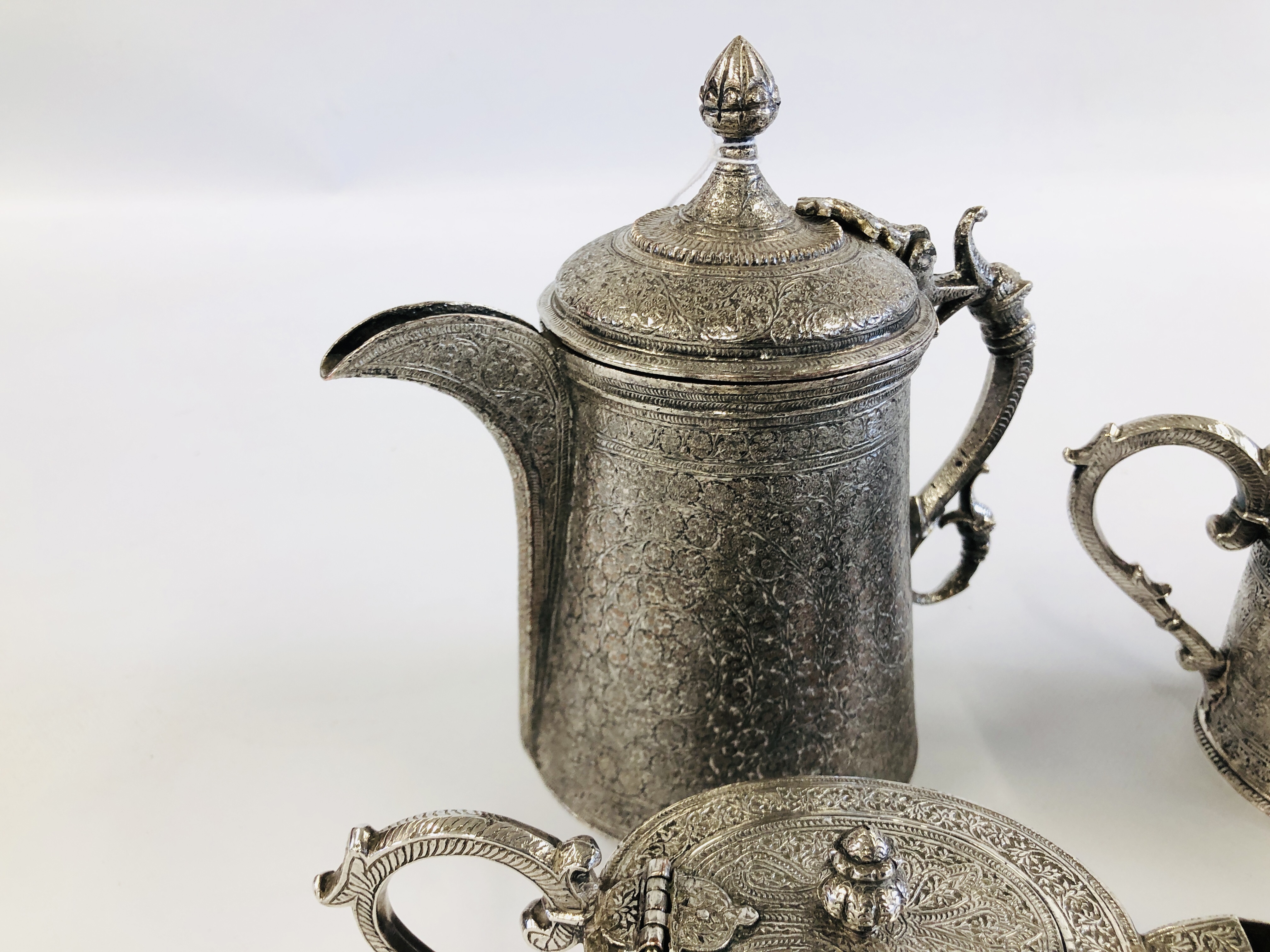 AN ELABORATE INDIAN METAL 4 PIECE TEA SET. - Image 5 of 5