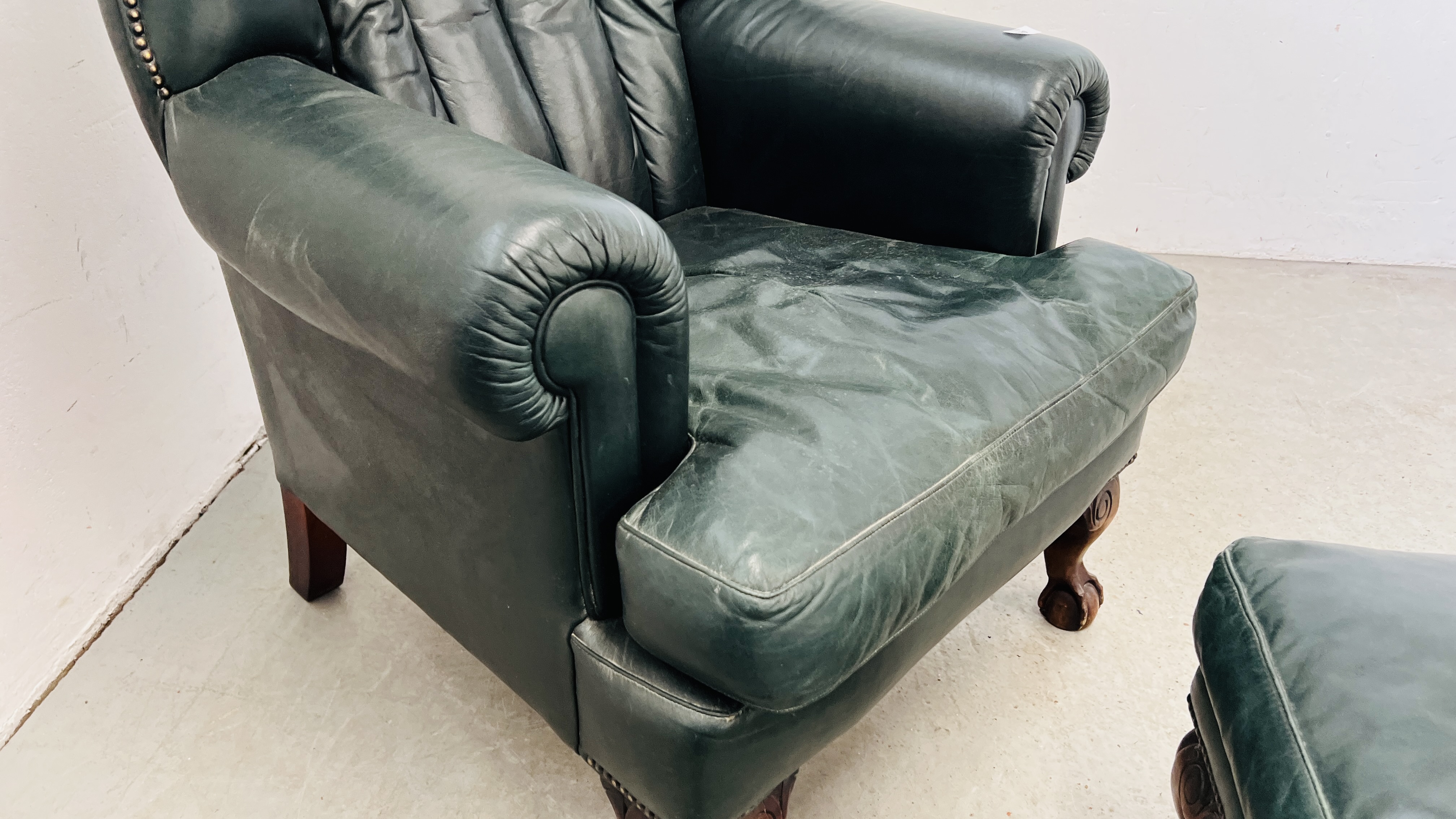 A PAIR OF MODERN BOTTLE GREEN LEATHER WING BACK FIRE SIDE ARMCHAIRS ON BALL AND CLAW FEET ALONG - Image 8 of 13