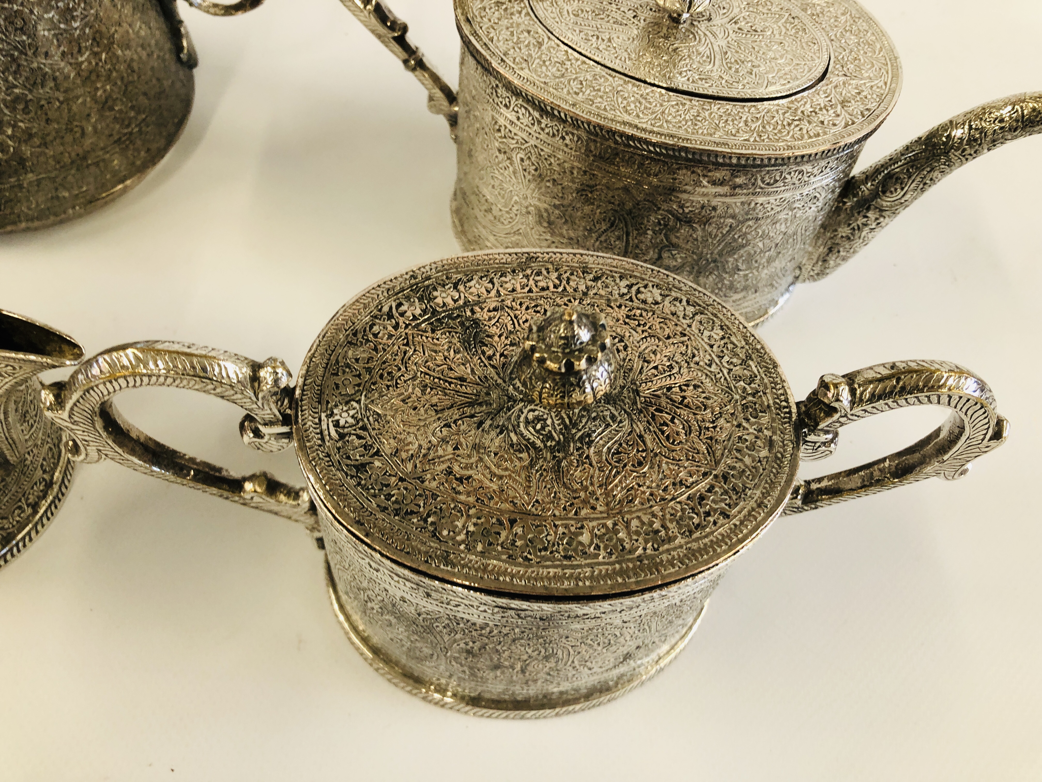 AN ELABORATE INDIAN METAL 4 PIECE TEA SET. - Image 3 of 5