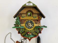 A VINTAGE DUTCH STYLE COCO CLOCK WITH WEIGHT AND PENDULUM.
