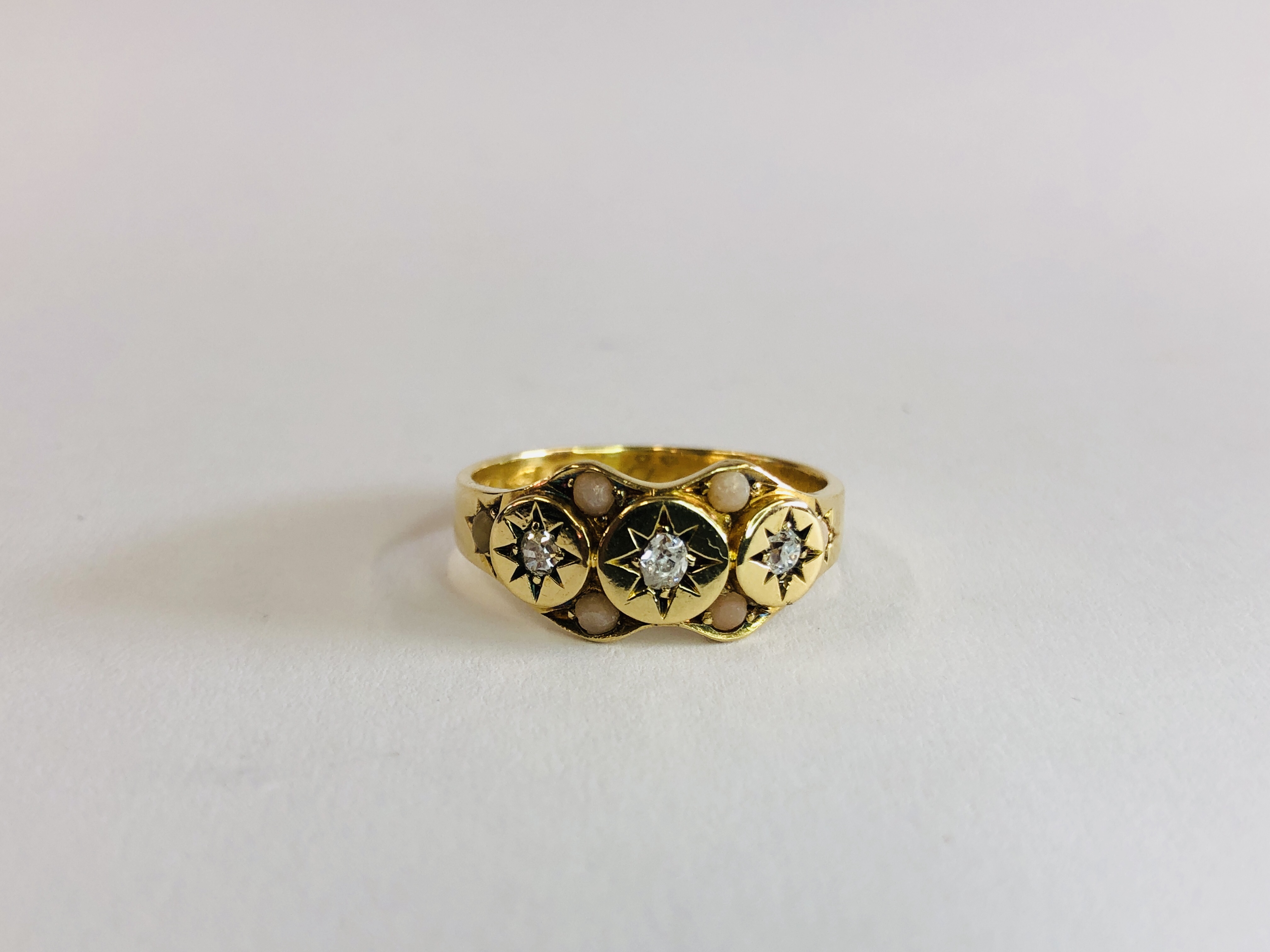 AN ANTIQUE 18CT GOLD DIAMOND AND CORAL RING, CHESTER 1883.