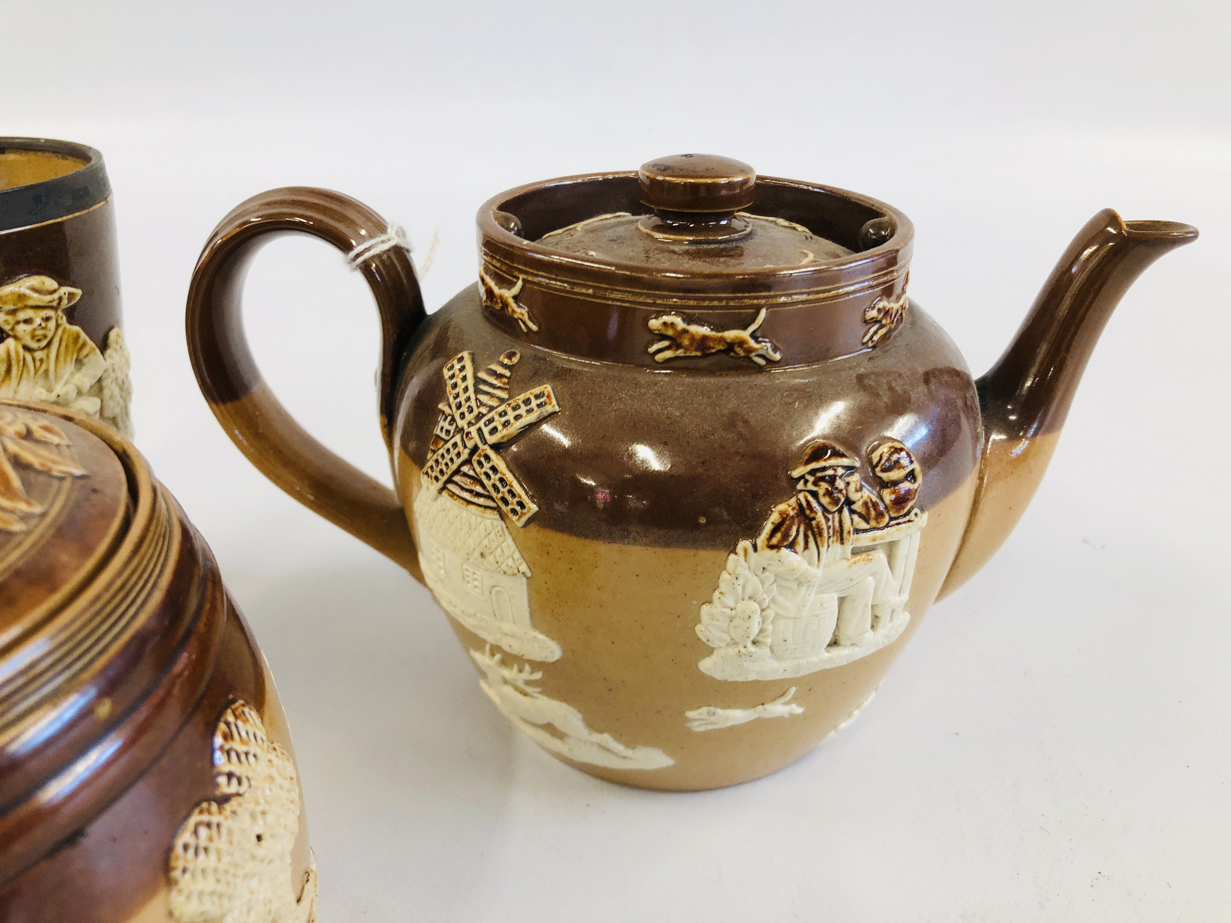 FOUR PIECES DOULTON TO INCLUDE TWO TEA POTS, TOBACCO JAR AND SILVER RIMMED BEAKER A/F. - Image 2 of 7