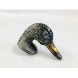 A VINTAGE ALUMINIUM CAR MASCOT IN THE FORM OF A DUCK'S HEAD INSCRIBED TO THE BASE "DUCKY".