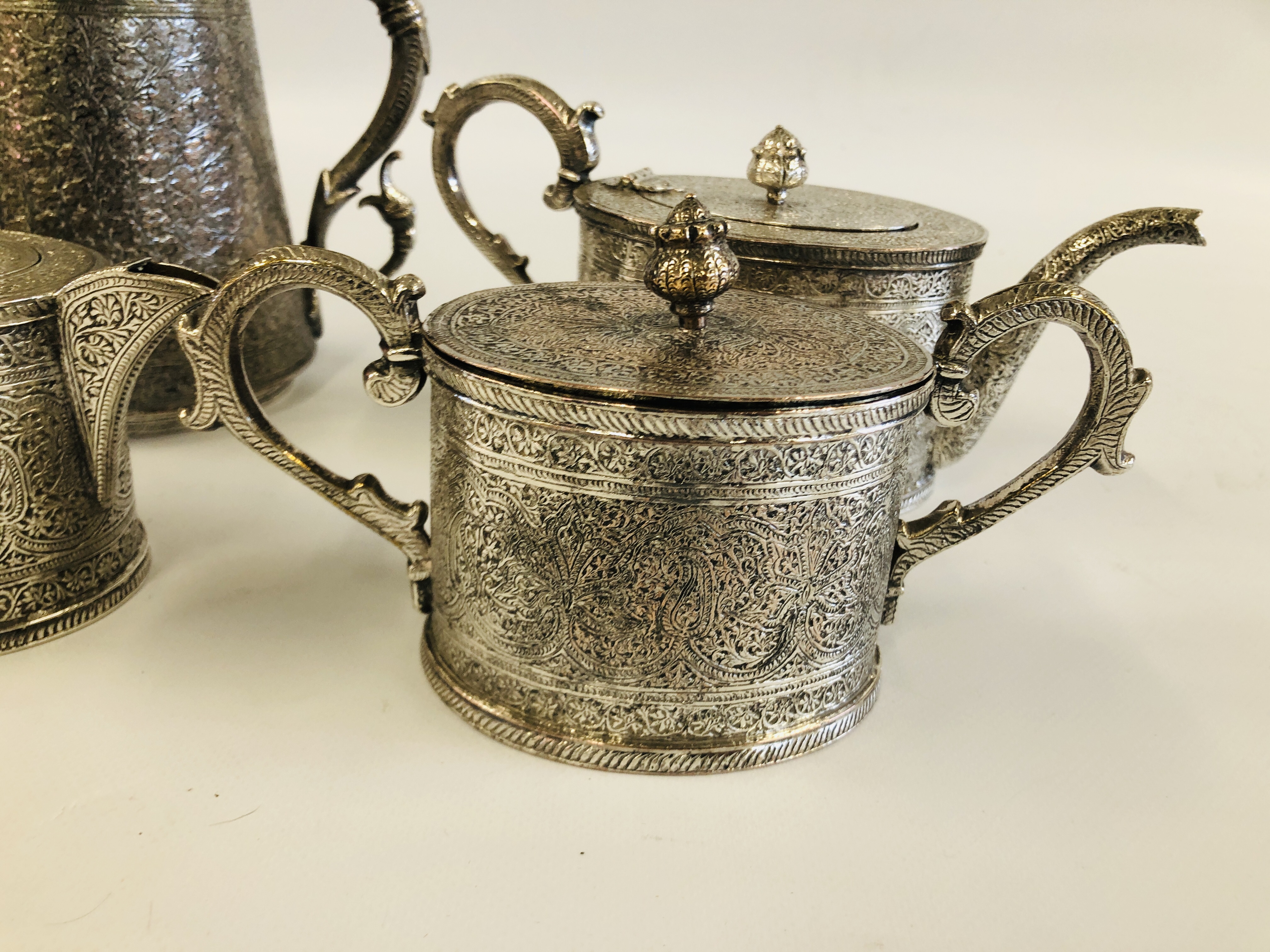 AN ELABORATE INDIAN METAL 4 PIECE TEA SET. - Image 2 of 5