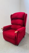 A GOOD QUALITY RED UPHOLSTERED ELECTRIC RECLINER / MASSAGER CHAIR WITH WOODEN ARMS.