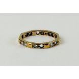 A 9CT GOLD DIAMOND ETERNITY RING (2 STONES MISSING)