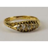 AN ANTIQUE 18CT GOLD FIVE STONE DIAMOND RING.