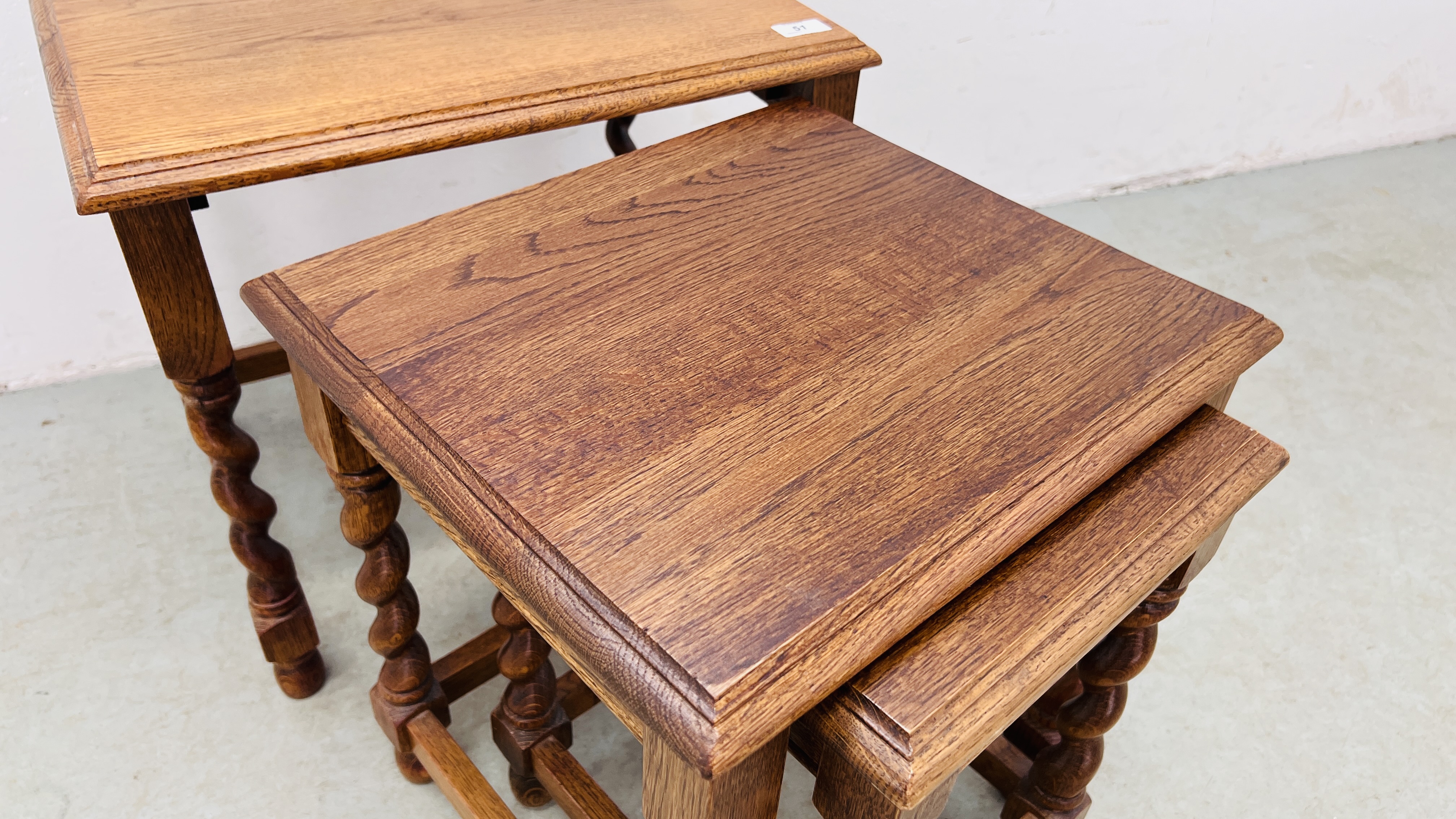 A NEST OF THREE GRADUATED OAK TABLES. - Image 5 of 5