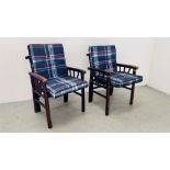 A PAIR OF BAMBOO ARMCHAIRS WITH CHECKED CUSHIONS.